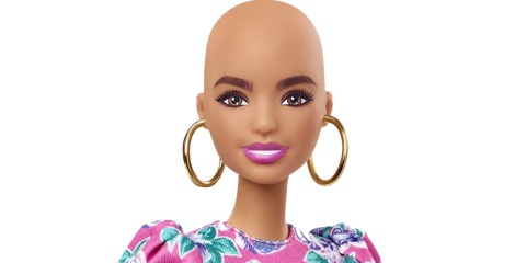 A Barbie doll with no hair