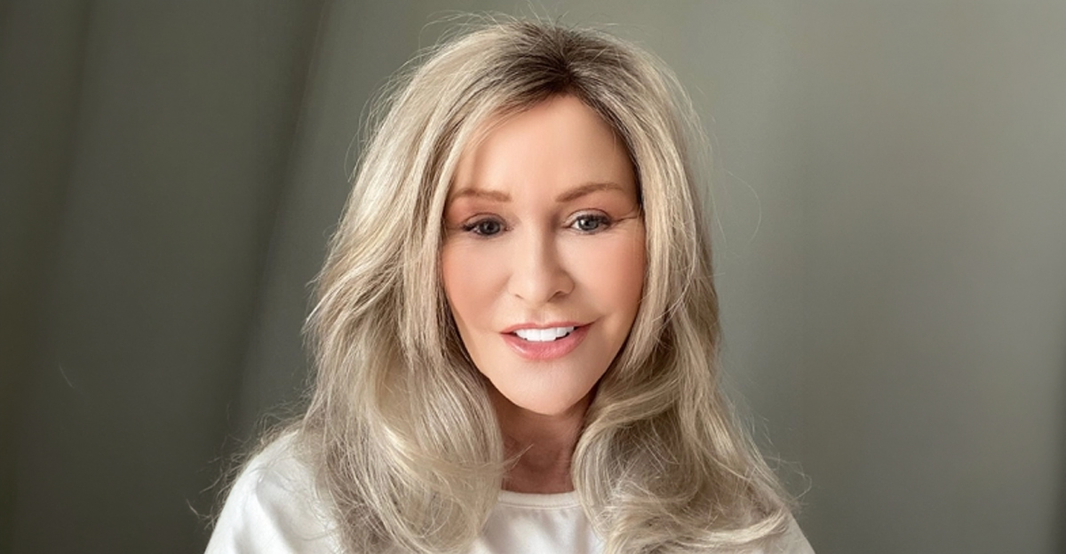 Bobbi wig by Envy styled as a smooth salon blow-dry