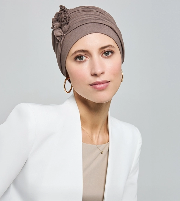 Lady wearing a professional head wraps for work.
